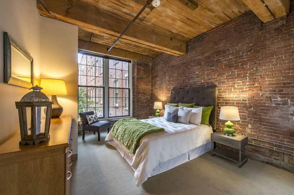 The Apartments at Boott Mills in Lowell, Mass., is an adaptive reuse project by WinnDevelopment. Property manager WinnResidential works with Esusu, a financial technology company, to help residents report on-time rent payments directly to the credit bureaus. Image courtesy of WinnCompanies