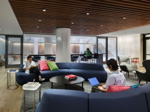 The coworking lounge at Lyra, a residential tower located near Hudson Yards. The coworking area, which resembles a lounge or hotel lobby, gives residents both flexible seating and work options, giving them the same degree of functionality as they move throughout the property. Image courtesy of MdeAS.