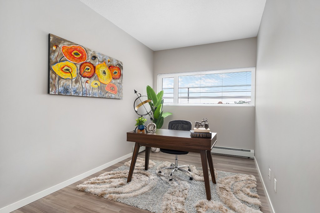 Staging a unit with clean, modern furniture before taking professional pictures can help prospective residents in envisioning their own life in the community. Image by Caydence Photography courtesy of FirstService Residential.