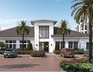 Property exterior of a white building with large windows flanked by palm trees