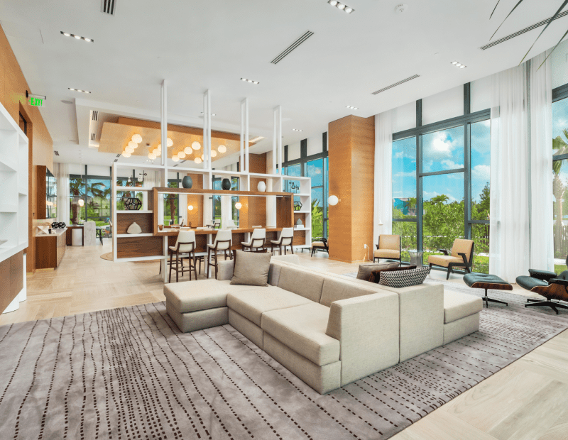Interior shot of communal tables and high-top bar seating at SoLé Mia in Miami