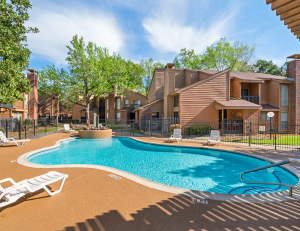 Houston Oaks apartment community in northeast Houston with pool in the foreground.