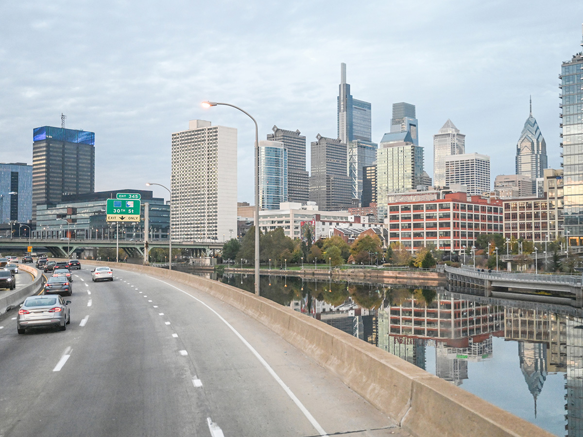 Skyline of Philadelphia city. Car traffic.
