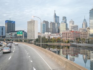 Skyline of Philadelphia city. Car traffic.