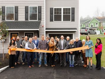 Ribbon-cutting ceremony in honor of the grand opening of Saddle Rock, a 64-townhouse community in Manchester, N.H.