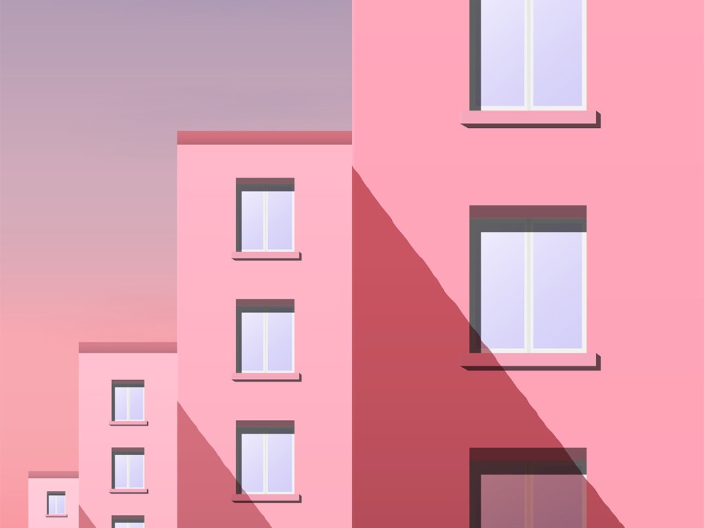 Day city landscape. Part of the street with a number of new panel houses in pink tones against the Sunny sky.