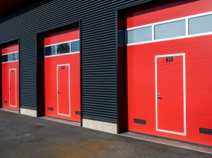 Exterior shot of self storage units with red doors
