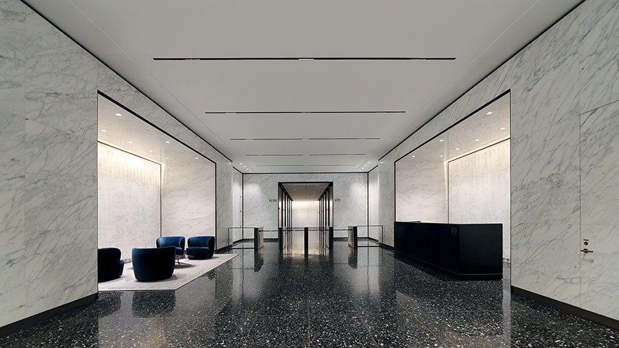 The prior owners of 55 Broad Street invested significantly into lobby and elevator upgrades. These recent improvements, done before the acquisition, allowed Metro Loft to keep much of the renovated lobby and its existing infrastructure such as lighting and marble. “Before” image courtesy of Conway Partners