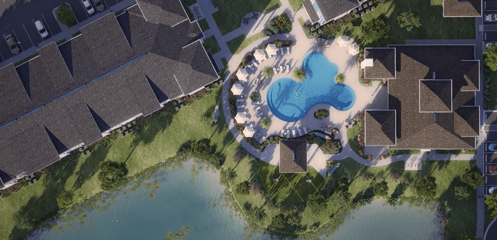 An image of Jewel at Santa Rosa Beach, an apartment community, showing the large event lawn included by the developer as a way for residents to gather outside.