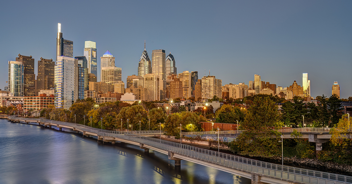 The skyline of Philadelphia with the Schuylkill River at twilight