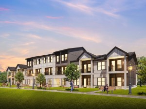 Exterior rendering of one of the buildings within the Tanner Road multifamily project. The residential structure has a white and gray exterior, as well as a brick façade.