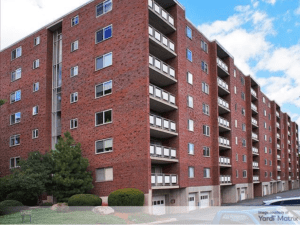 Exterior shot of one of the buildings at Hill Estates, a 396-unit multifamily property in Boston's suburb of Belmont.