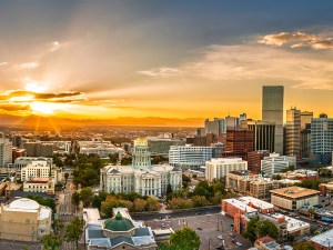 Aerial panorama of Colorado Capitol and Denver, Colorado skyline at sunset. Denver is a consolidated city and county, the capital, and most populous city of the U.S. state of Colorado