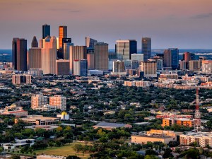 The modern skyline of Houston, Texas at dusk on a spring evening shot via helicopter from an altitude of about 800 feet.