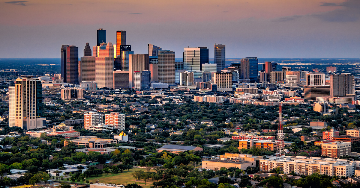 The modern skyline of Houston, Texas at dusk on a spring evening shot via helicopter from an altitude of about 800 feet.