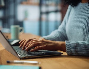 Woman's hands on laptop