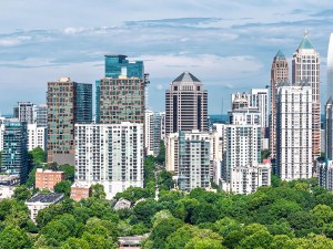 Drone angle view of Atlanta Georgia skyline with Piedmont Park and lake in the foreground.