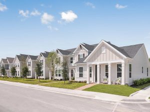 Exterior shot of a row of houses at Clear Lake Reserve Townhomes, a single-family rental community in Pooler, Ga.