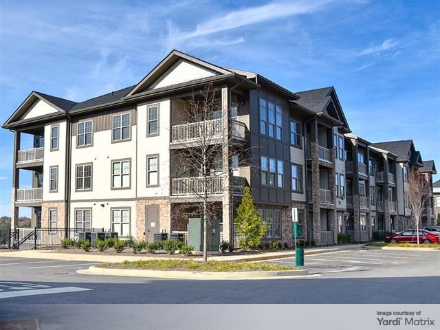Exterior shot of one of the 14 buildings of Timberline View, formerly Town Laurel Crossing. Related and Rockpoint sold this multifamily asset in Buford, Ga., for 0 million to DBG and GSL.