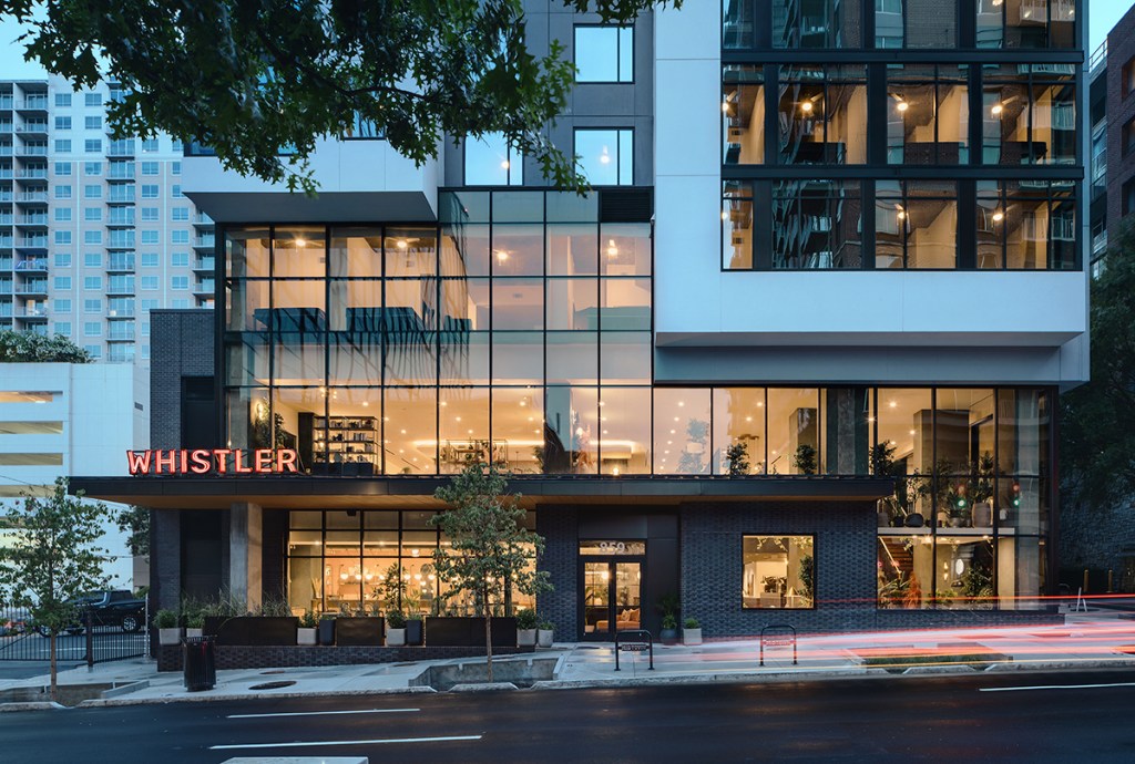 The high-rise sits in a central Atlanta location, with the lobby and patio available to residents and community members alike.