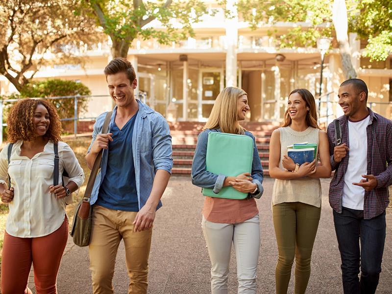 Group of multiethnic students walking going to classroom at university. Concept of First day of school.