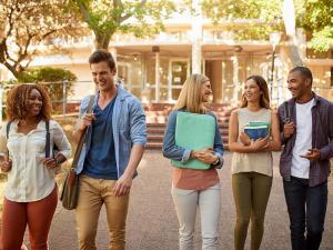 Group of multiethnic students walking going to classroom at university. Concept of First day of school.
