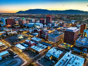 Downtown Albuquerque aerial at dawn with the Sandia Mountains in the background. Image can be used as a dusk shot.