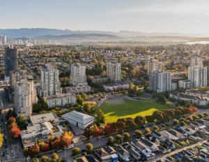 Aerial perspective of Vancouver's skyline, highlighting Collingwood Village, a Concert Properties development.