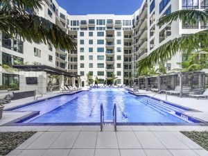 Exterior shot featuring part of the amenity package of Aster & Links, a multifamily property in Sarasota, Fla., owned by Belpointe OZ.