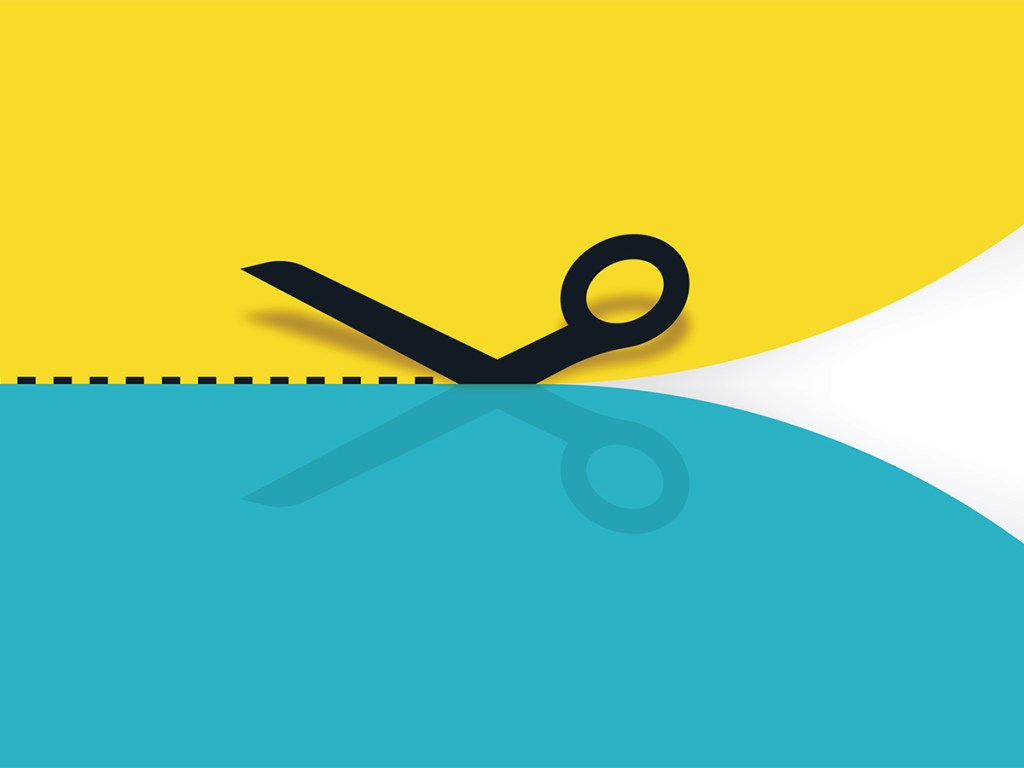 Scissors cutting paper concept.