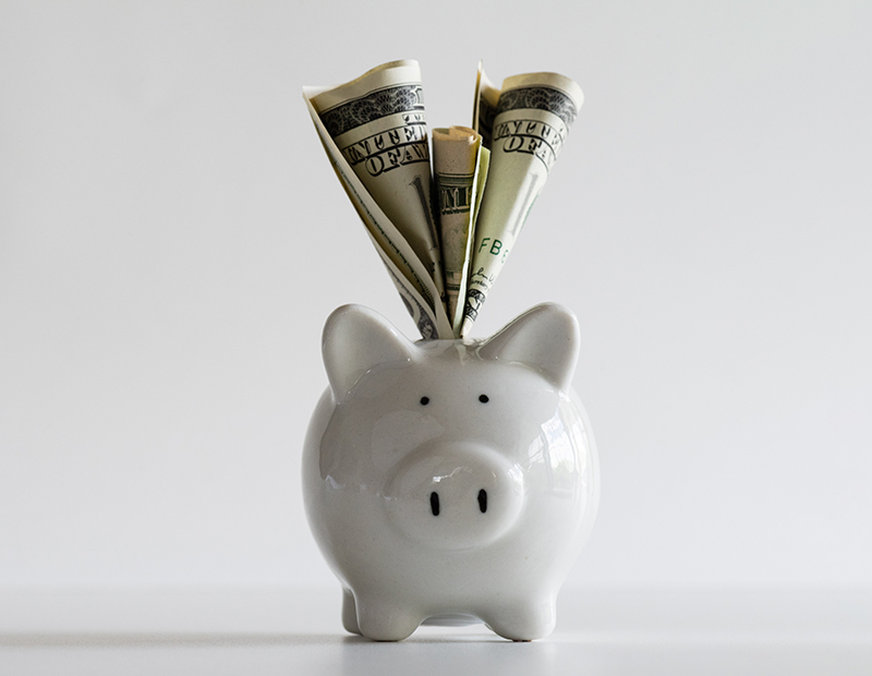 Piggy bank stuffed with cash