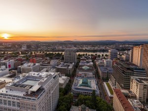 Downtown old town Portland, Oregon, at dawn, with Mount Hood in the horizon, Willamette river