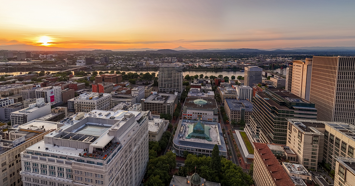 Downtown old town Portland, Oregon, at dawn, with Mount Hood in the horizon, Willamette river