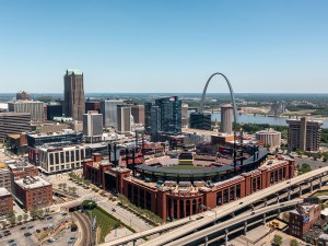 St Louis, United States – June 21, 2021: Aerial view of Busch Stadium in St. Louis with the downtown skyline and Gateway Arch in the background.