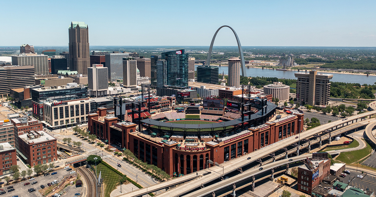 St Louis, United States – June 21, 2021: Aerial view of Busch Stadium in St. Louis with the downtown skyline and Gateway Arch in the background.