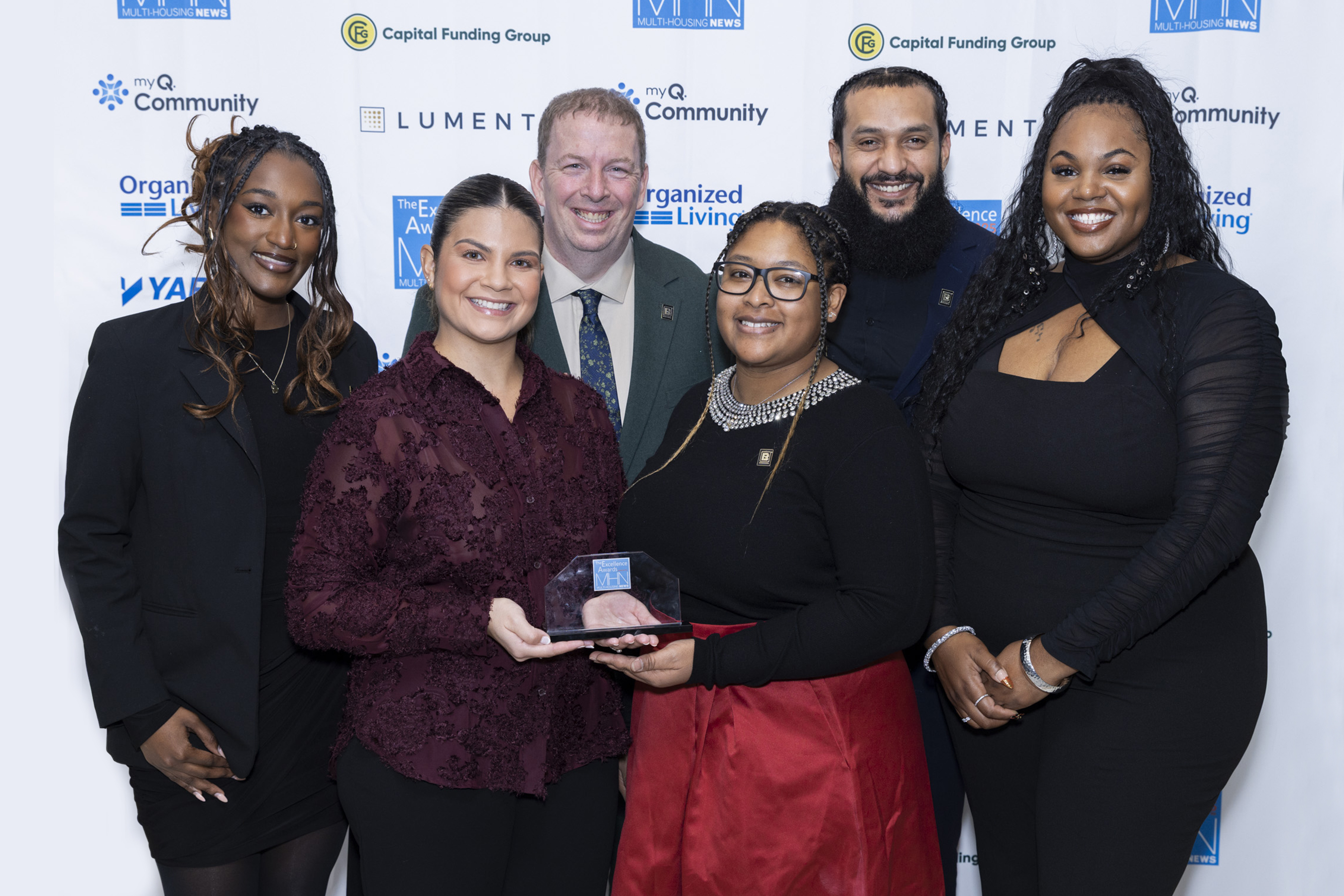 Group photo of The Breeden Company. The Breeden Company won Gold, Best Operations (Reflections of Virginia Beach); Silver Humanitarian Award and Marketing Executive of the Year (Christine Gustafson); Bronze, Facilities & Maintenance Manager of the Year (Steve Roldan) and Rising Star (Nevaeh Arrington). Image by Gary Spector