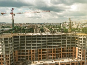 Construction site background. Under construction. Crane near building. Industrial background. Top view of future skyscraper.