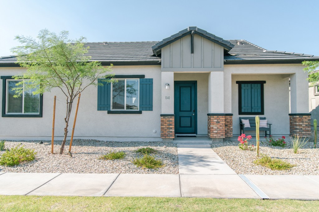 Exterior shot featuring one of the homes inside the Avilla Western Garden build-to-rent property owned by NexMetro in Phoenix.