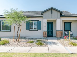 Exterior shot featuring one of the homes inside the Avilla Western Garden build-to-rent property owned by NexMetro in Phoenix.