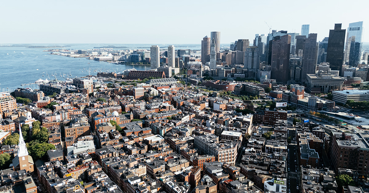 Aerial view of Boston city, bridges and river with skyline in sunlight. g.