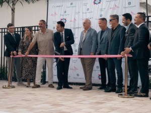 Prestige Cos., Brunetti Organization and Centennial Bank representatives celebrating the opening of Flamingo Village.