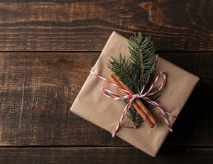 Image of a present wrapped in brown paper with twine.