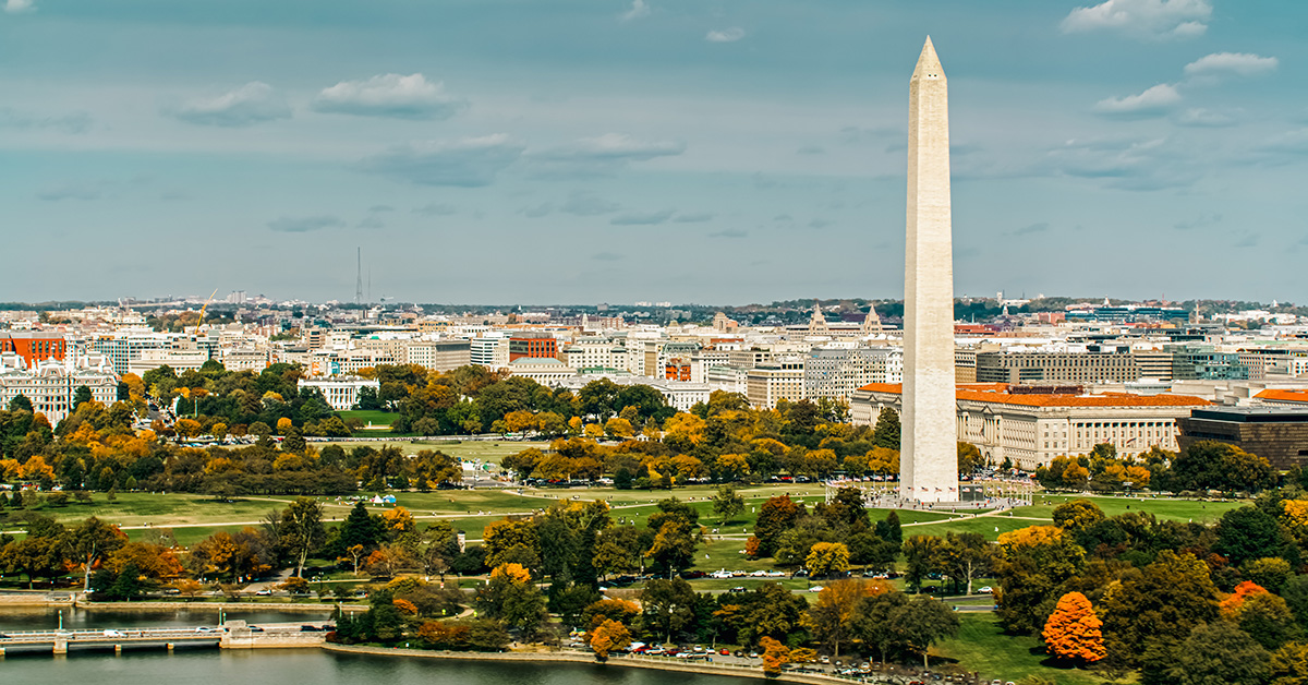 Aerial establishing shot of Washington, D.C. on a sunny day in Fall from over the Tidal Basin.