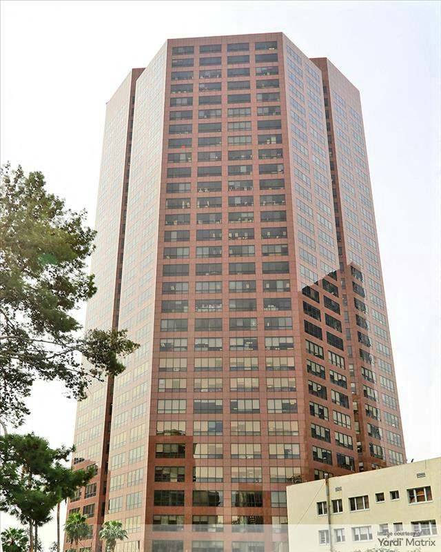 Exterior shot depicting the office tower at 1055 W. 7th St. in Los Angeles, which Jamison Services is converting to multifamily.