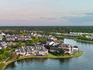Large mansion houses with swimming pool, in affluent neighborhood metroplex, expensive suburban homes surrounding by lush green trees, aerial view, Texas, USA