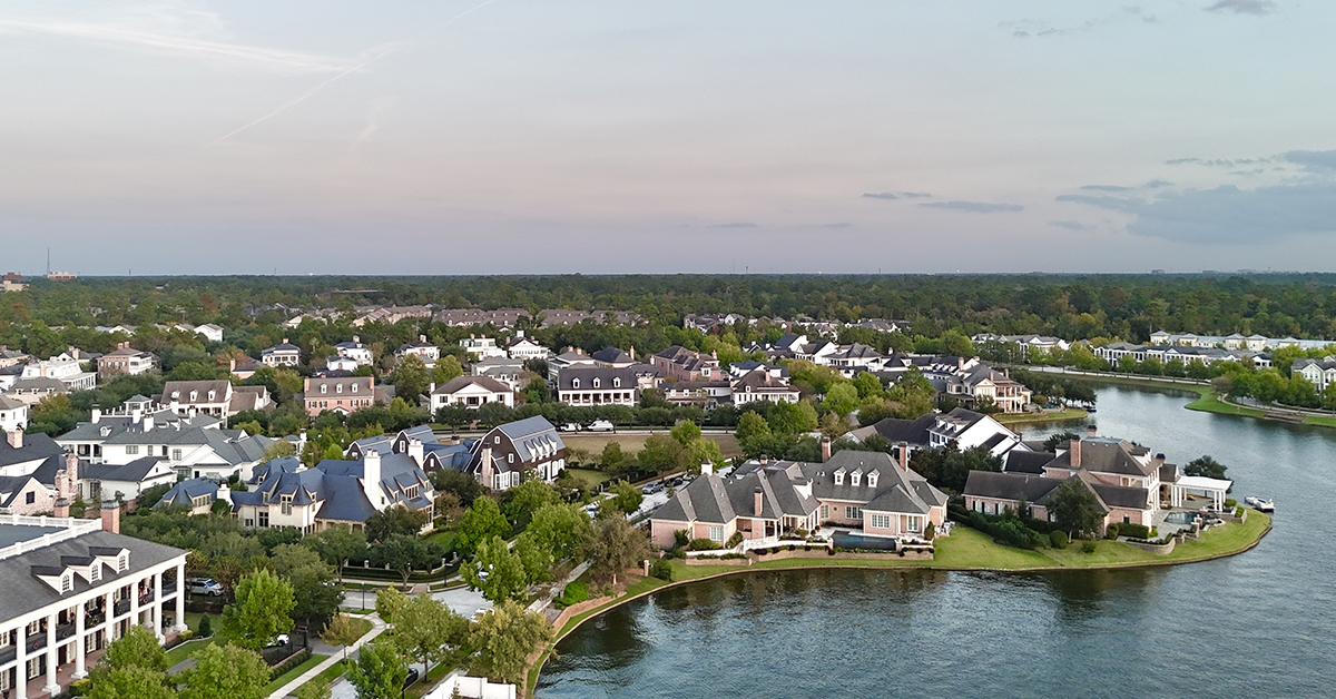 Large mansion houses with swimming pool, in affluent neighborhood metroplex, expensive suburban homes surrounding by lush green trees, aerial view, Texas, USA