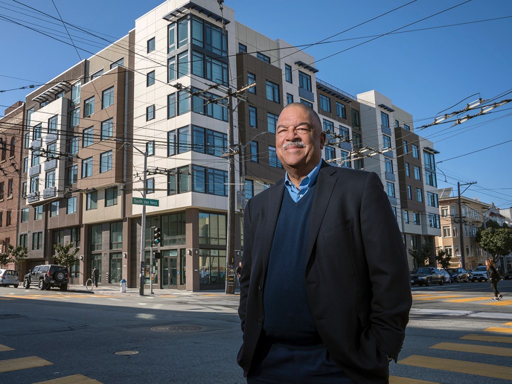 Ken Lombard, President and CEO of Bridge Housing, poses for a portrait in front of the Avanza 490 on 490 South Van Ness Ave. in San Francisco, California on Monday, March 21, 2022.