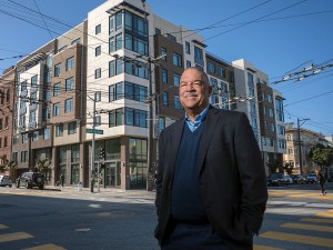 Ken Lombard, President and CEO of Bridge Housing, poses for a portrait in front of the Avanza 490 on 490 South Van Ness Ave. in San Francisco, California on Monday, March 21, 2022.