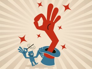 Businessman waving magic wand and then a big hand coming out of magic hat and showing ok hand sign