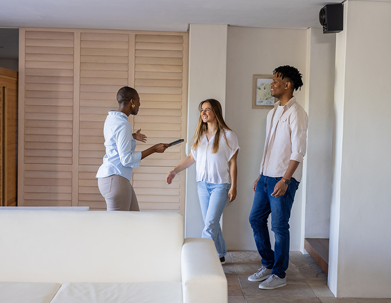 Agent showing people an apartment.